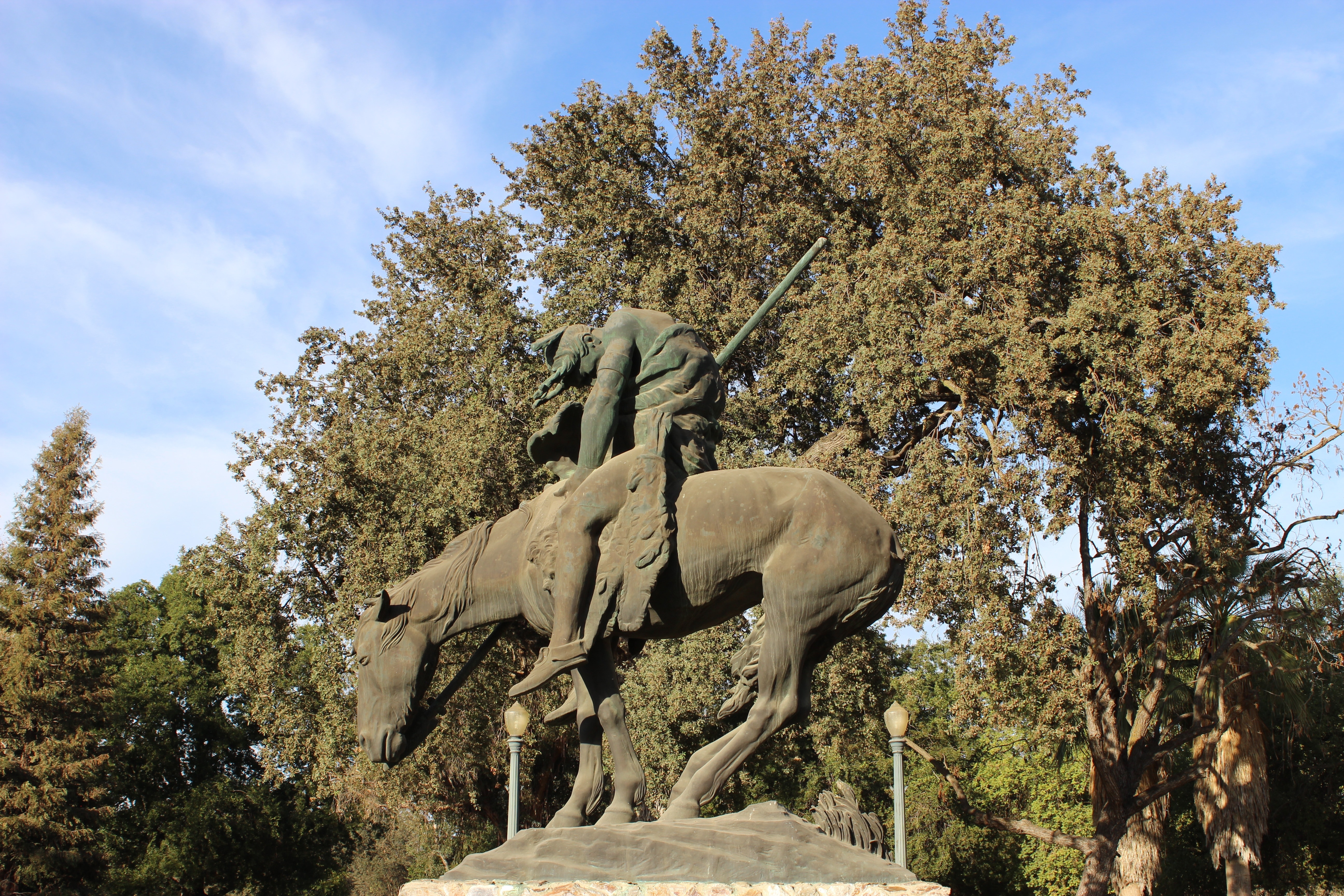 person riding horse statue