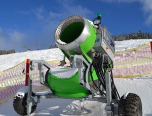 green and gray industrial snow thrower thumbnail