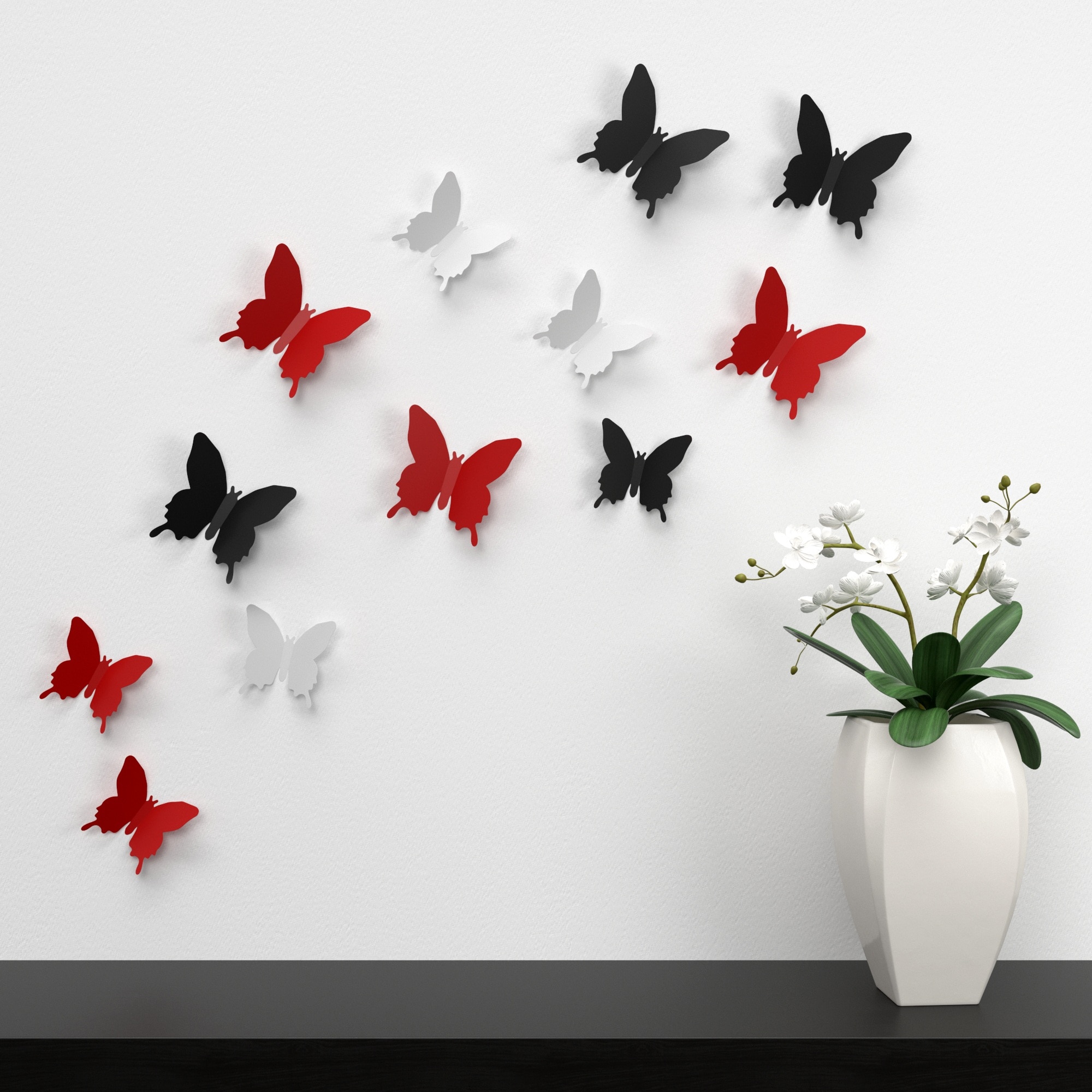 white, black, and red butterflies wall decor near white and green indoor plants