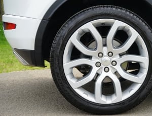 grey 5 spoke car wheel with tire thumbnail