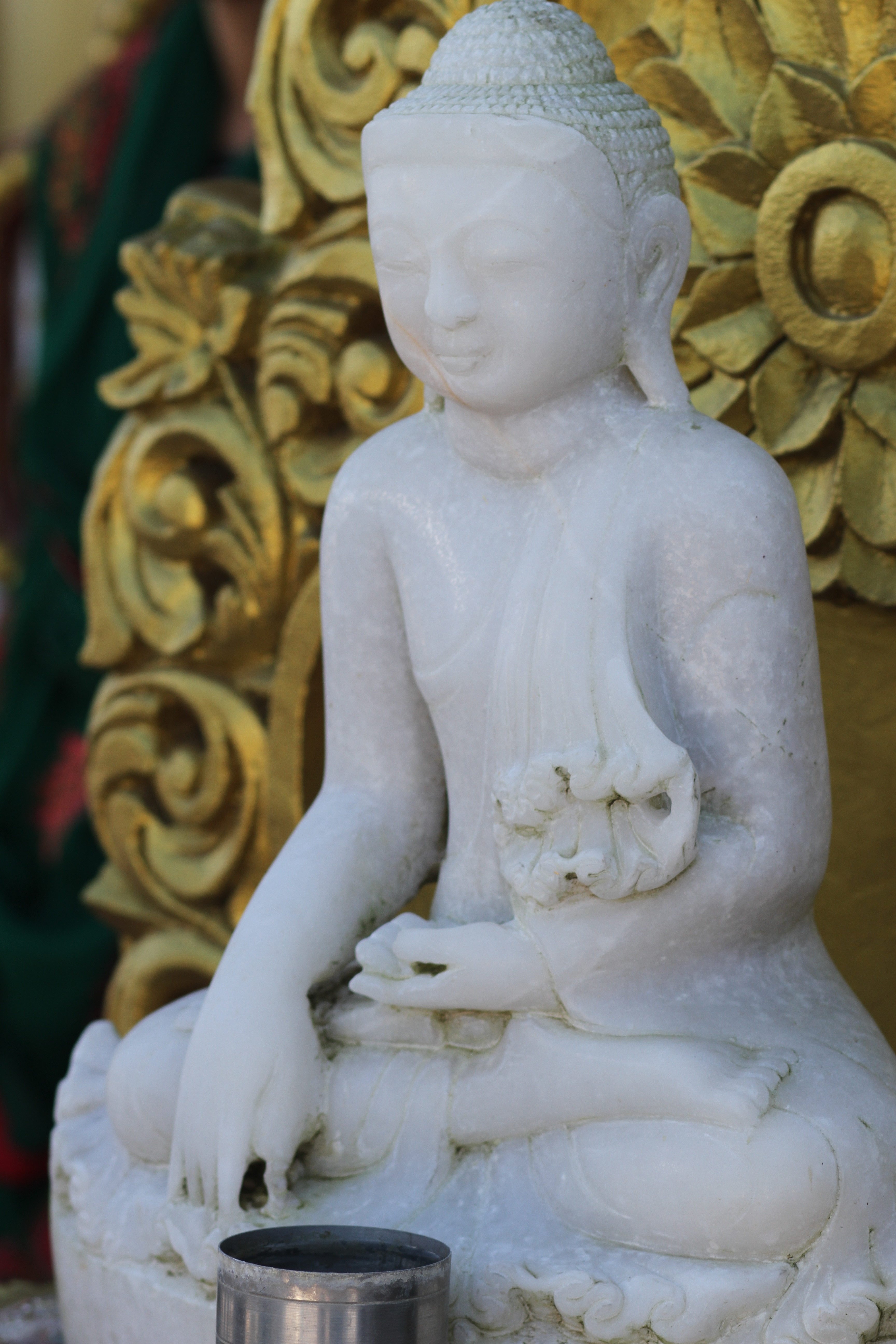 white buddha ceramic figurine