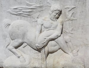 grey stone centaur wall sculpture thumbnail