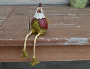 white red and green chicken toy figurine thumbnail