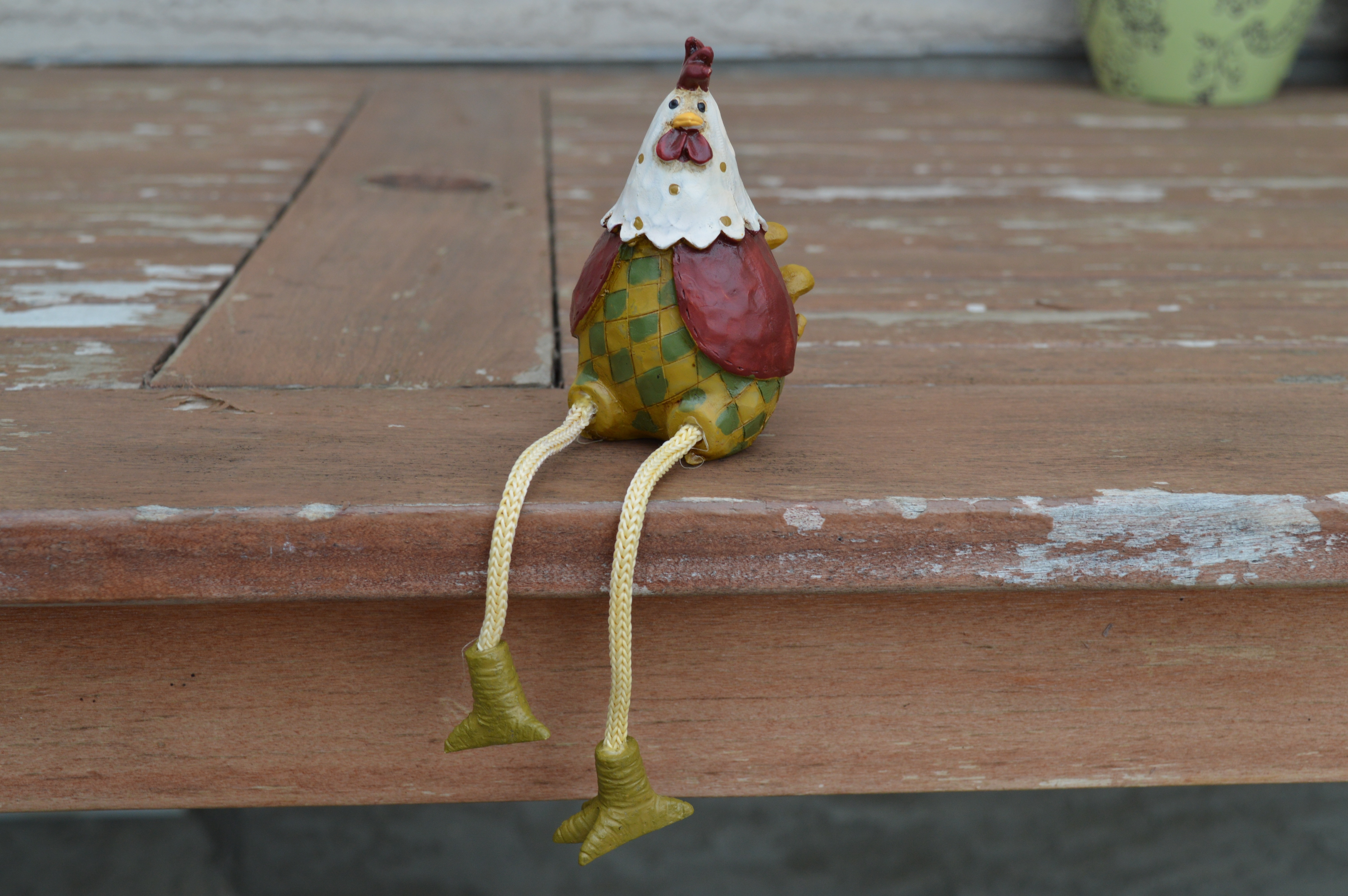 white red and green chicken toy figurine