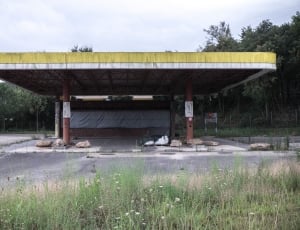 gas station surrounded by trees thumbnail