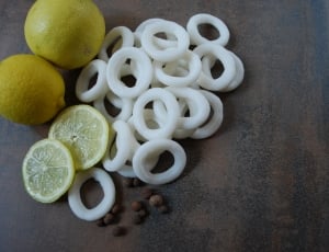two yellow lemons on brown surface thumbnail
