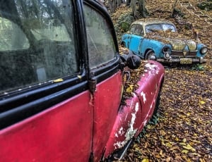 abandoned red and blue cars thumbnail
