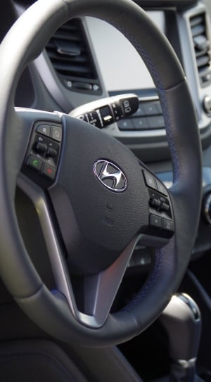 black hyundai multi functional steering wheel thumbnail