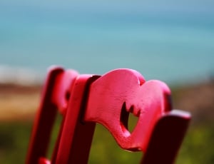 close up photo of two red wooden chair thumbnail