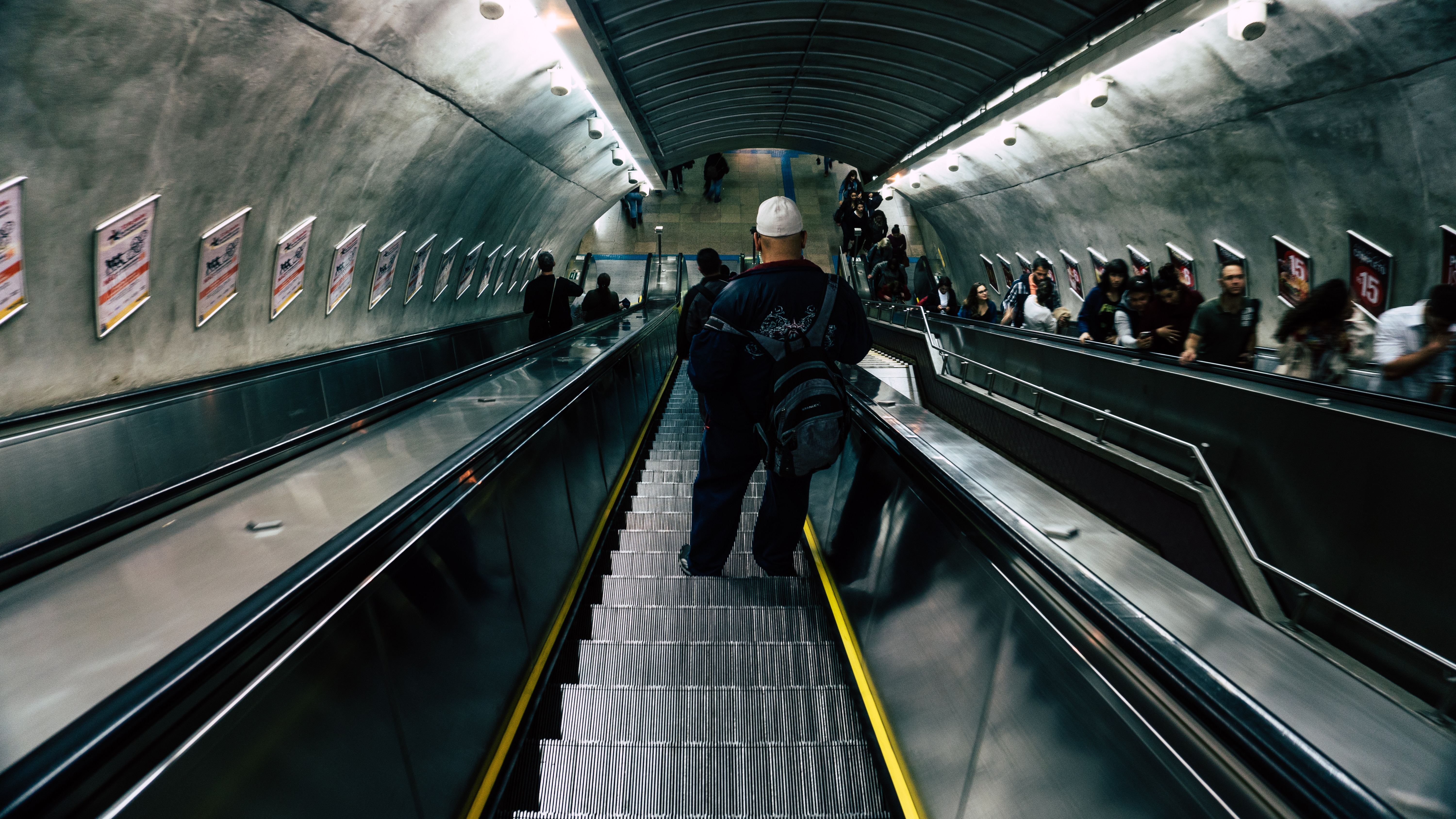 person riding on escalator photo