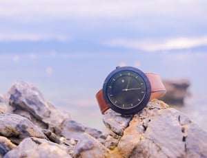 black and brown leather strap analog round watch thumbnail