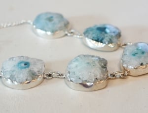 closeup photo of blue charm necklace thumbnail