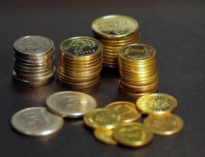 stack of gold and silver round coins thumbnail