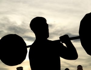 man holding barbell silhouette thumbnail