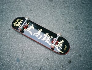 black and red kanji text lady skateboard thumbnail