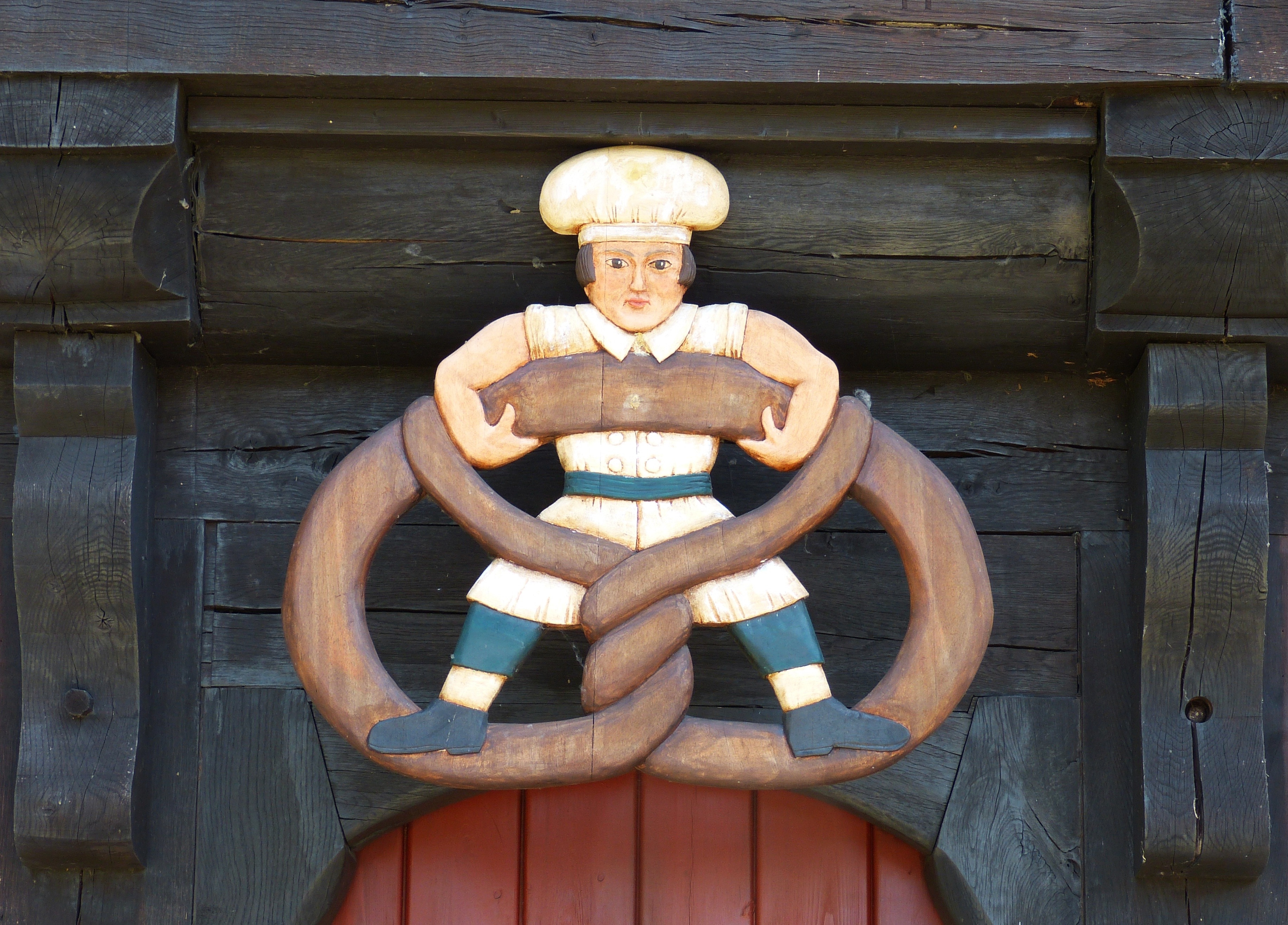man holding on to brown handle figurines