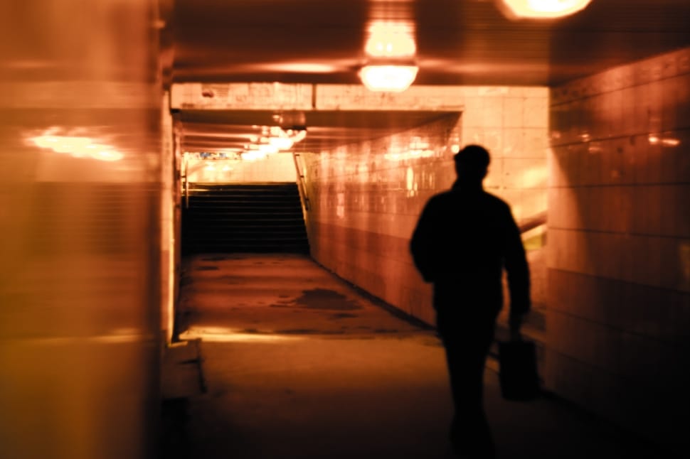 silhouette of man walking on hallway preview