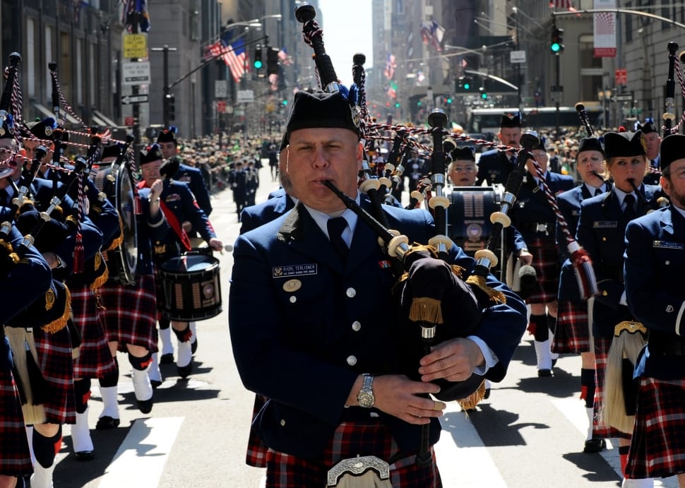 man in black and gray on parade playing bag pipes preview