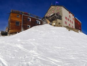 house on snow capped mountain thumbnail