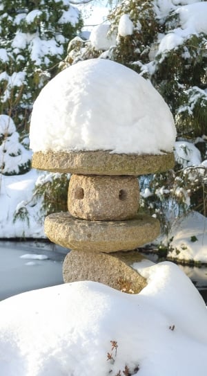 gray and brown stackable rock with snow on top thumbnail