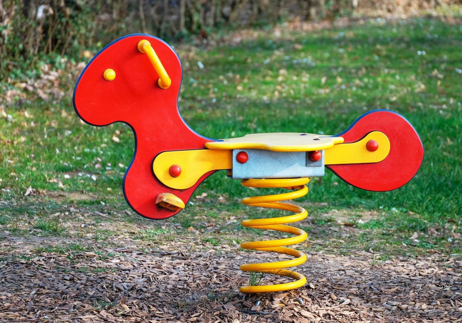 red and yellow spring rocking horse