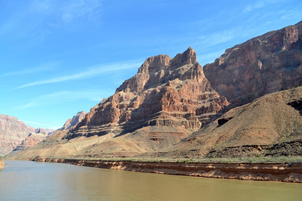 brown mountain with river during daytime preview