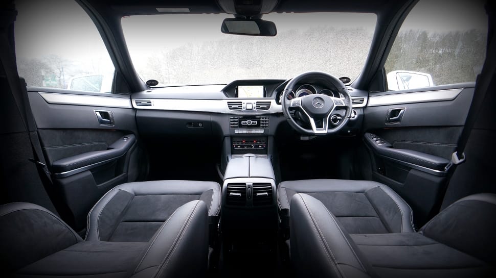 grayscale photo of car interior preview