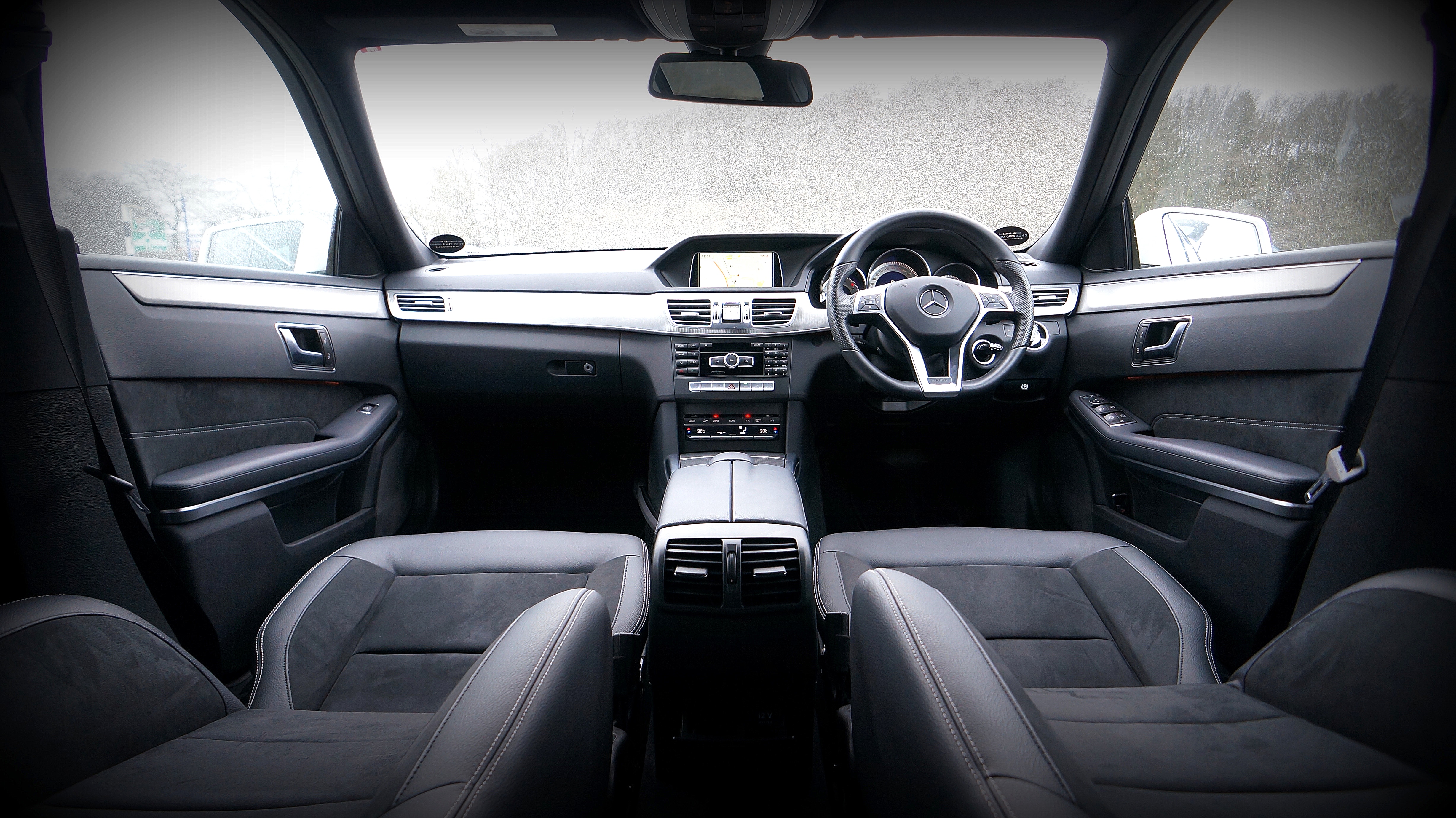 grayscale photo of car interior