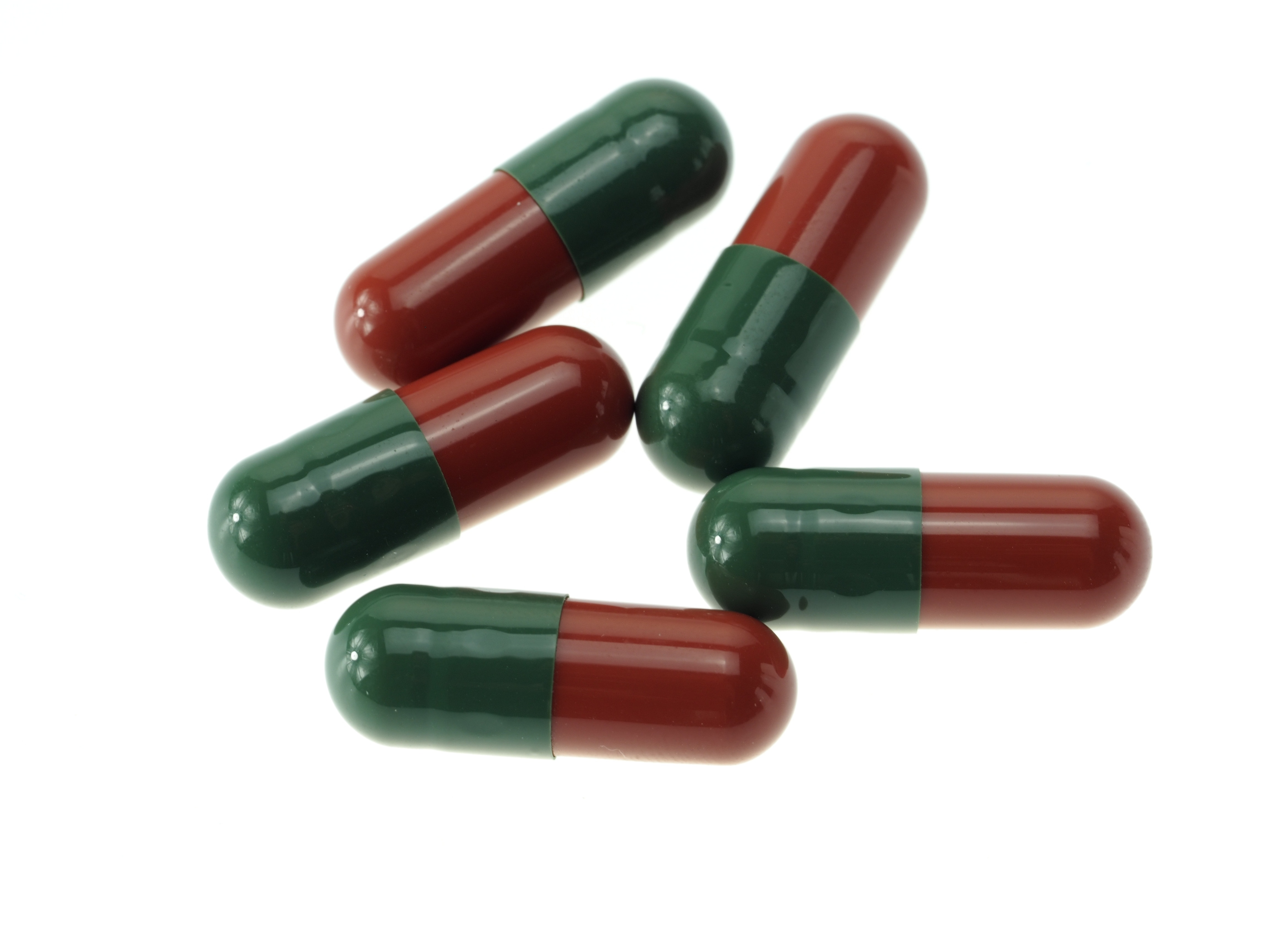 5 red and green medicine pills