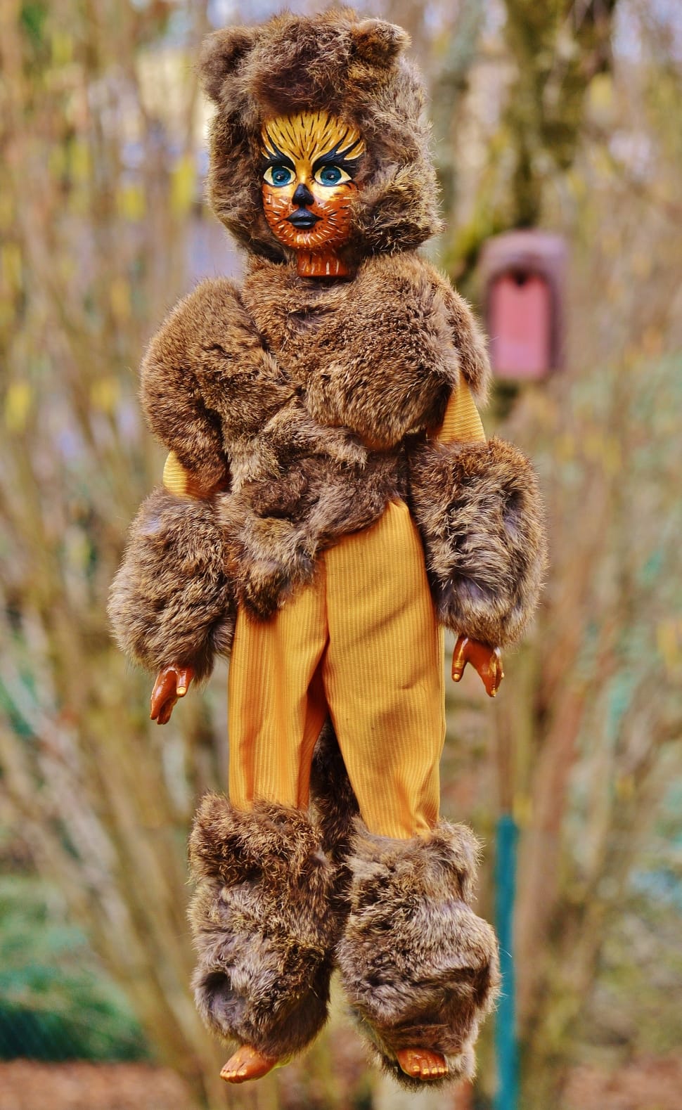person in brown fur bear costume doll preview