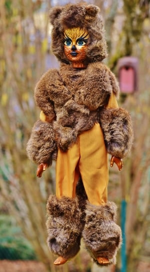 person in brown fur bear costume doll thumbnail