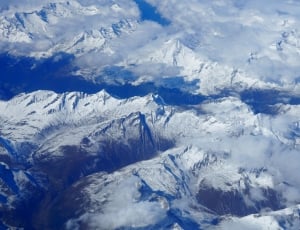 Blue White Clouds and Mountains Photo thumbnail