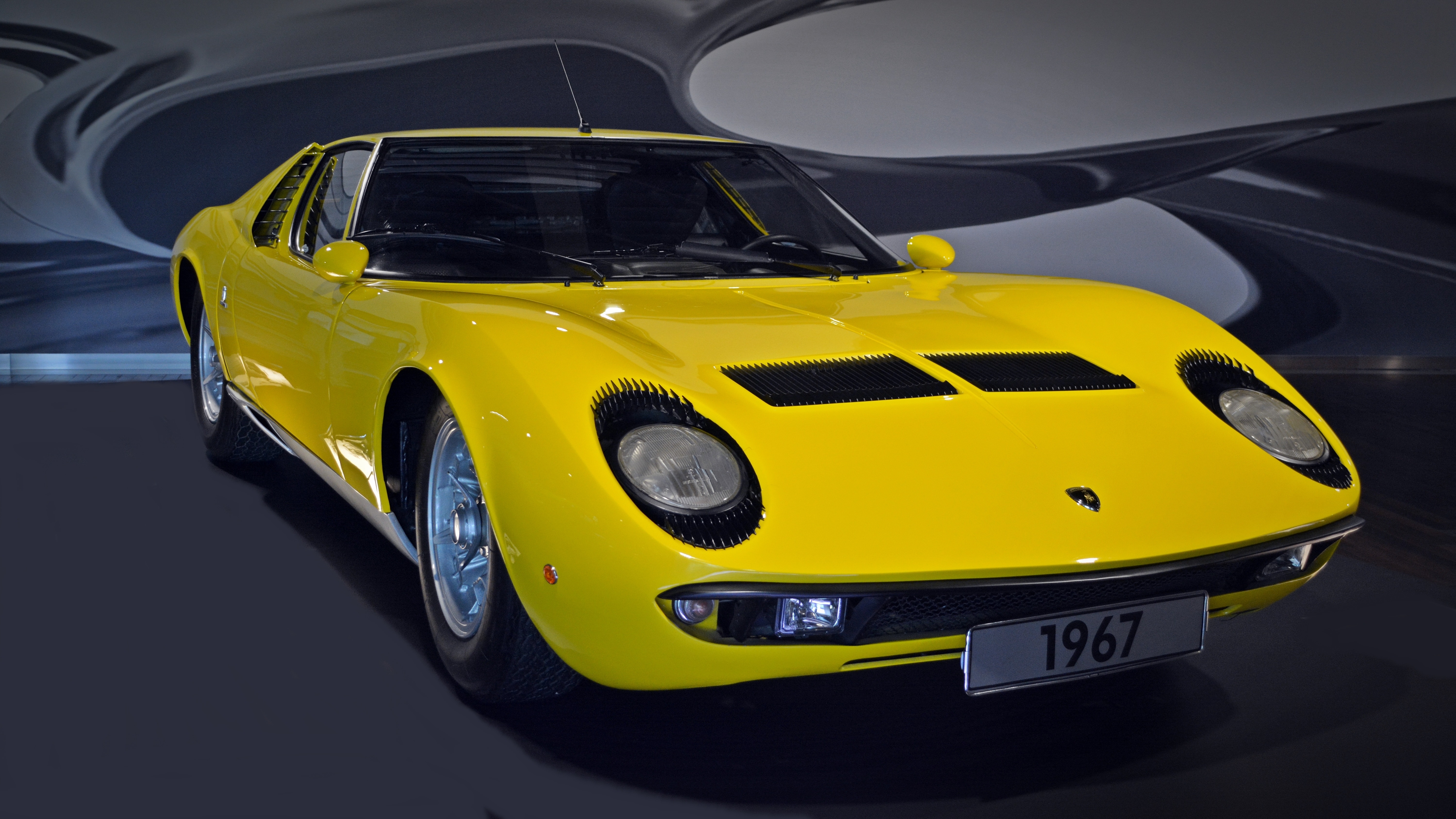 yellow 1967 porsche coupe
