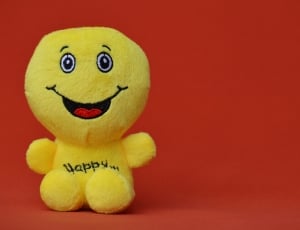 yellow happy plush toy thumbnail
