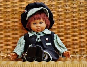 doll in blue and gray vest and dress shirt thumbnail