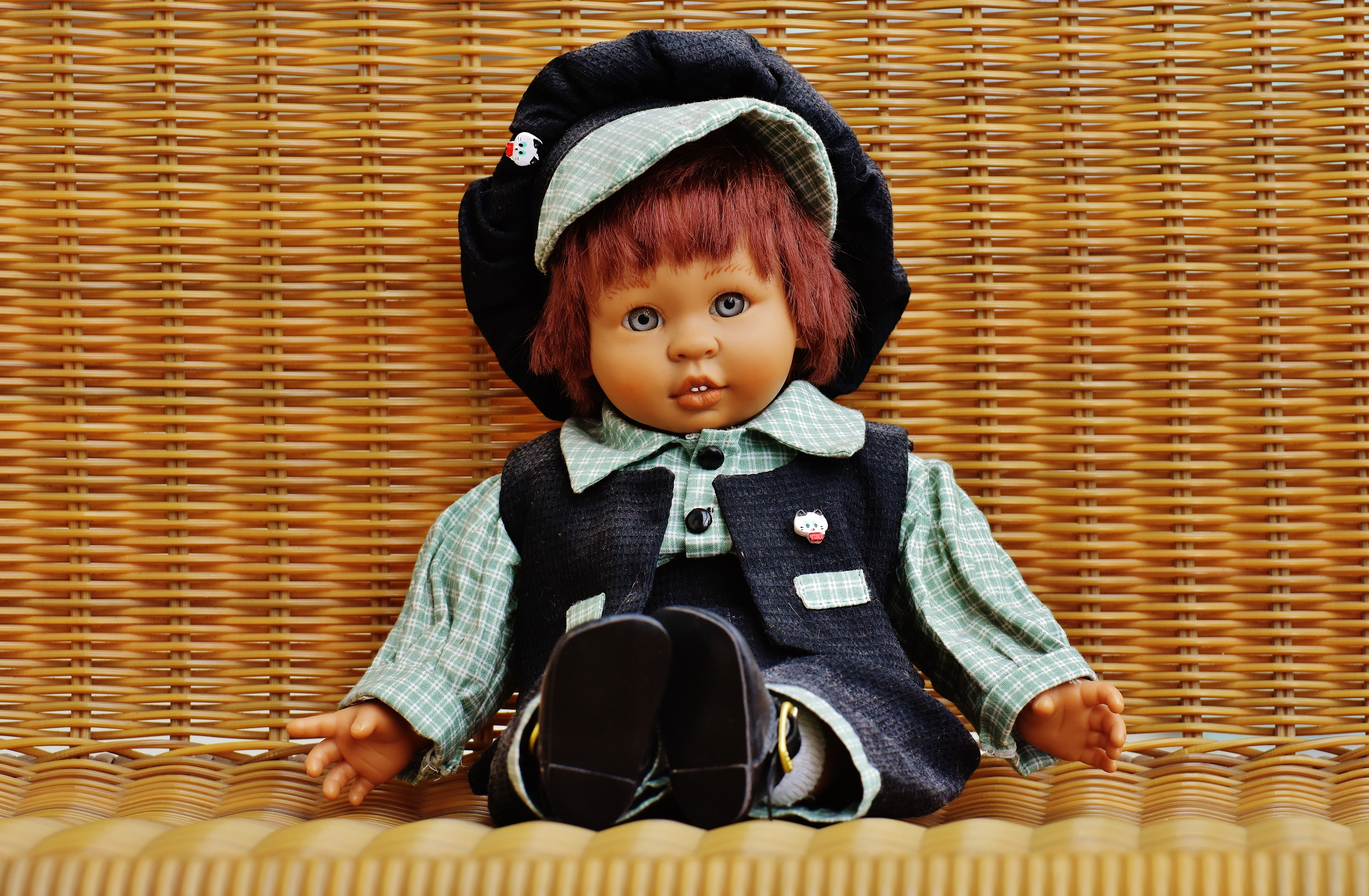doll in blue and gray vest and dress shirt