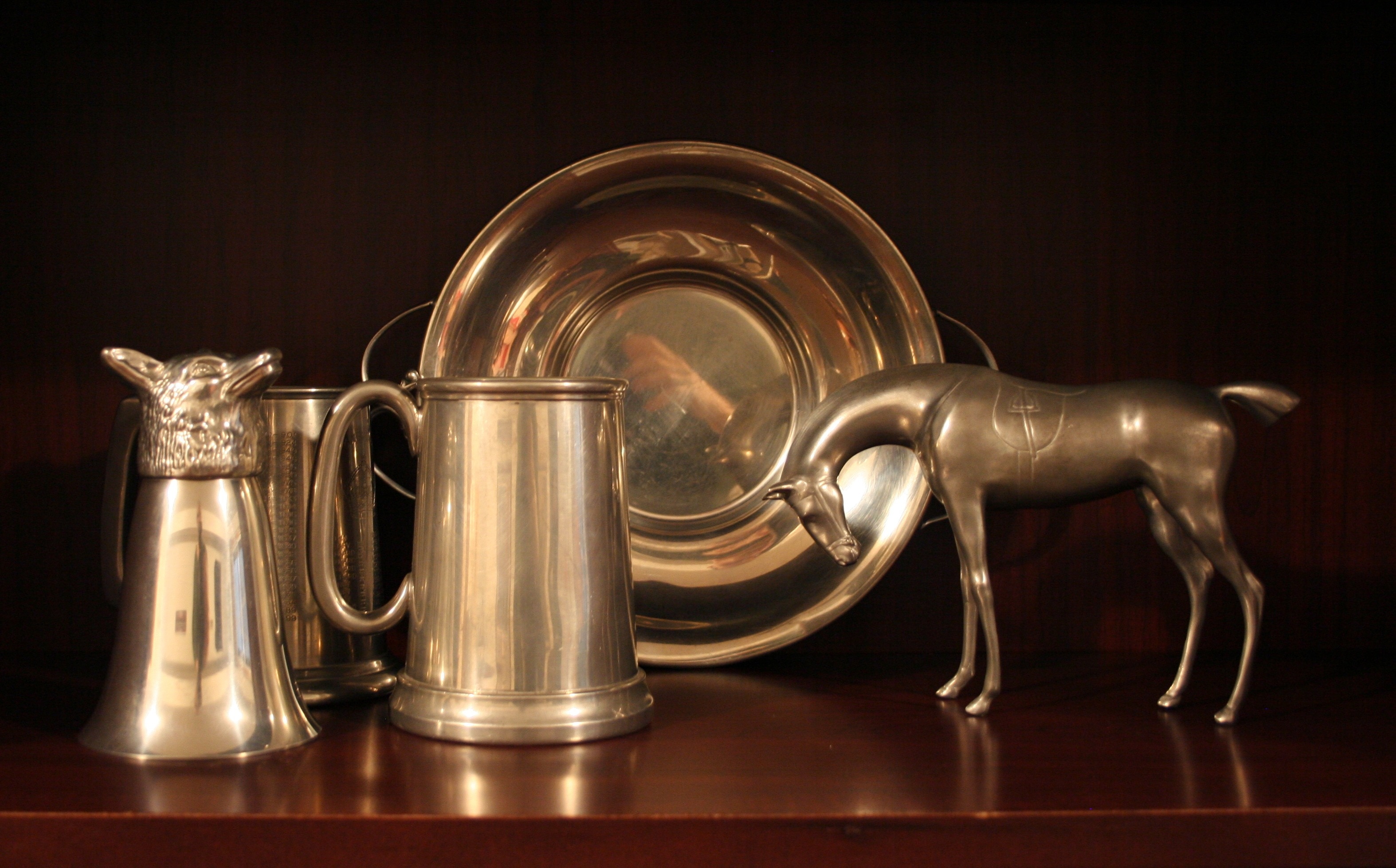 stainless steel mug bowl and horse figurine