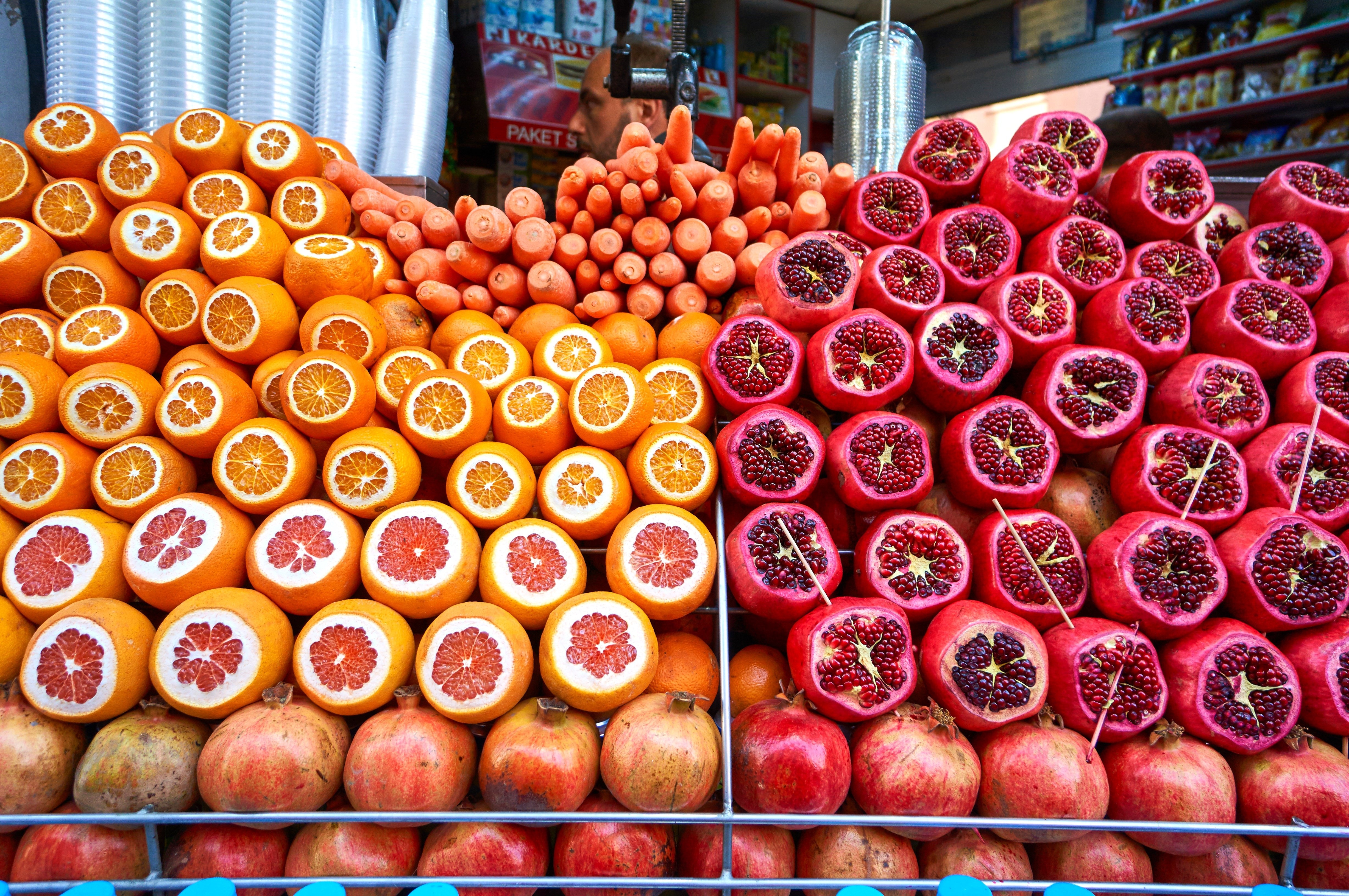 orange and red round fruits