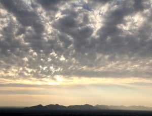 view of clouds and mountains thumbnail
