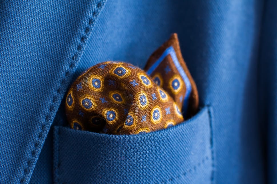 brown and blue textile inside blue pocket preview