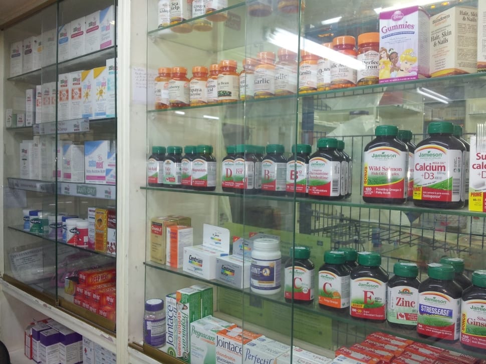 clear glass display commercial cabinet filled with assorted medication products preview