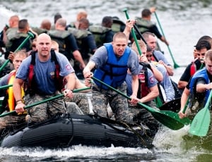 black inflatable raft and men's gray crew neck shirt thumbnail
