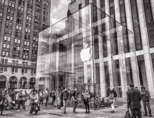 gray scale photo of people in front of apple brand building thumbnail