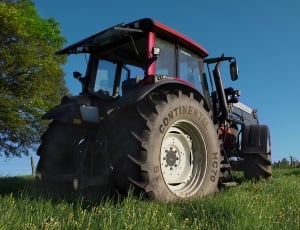 red and black tractor thumbnail