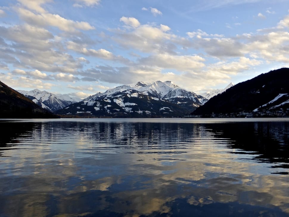 reflective photography of mountain and sea preview
