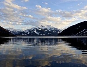 reflective photography of mountain and sea thumbnail