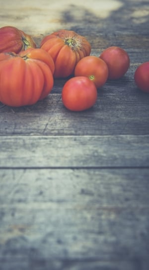 Tomatoes on gray wooden table thumbnail