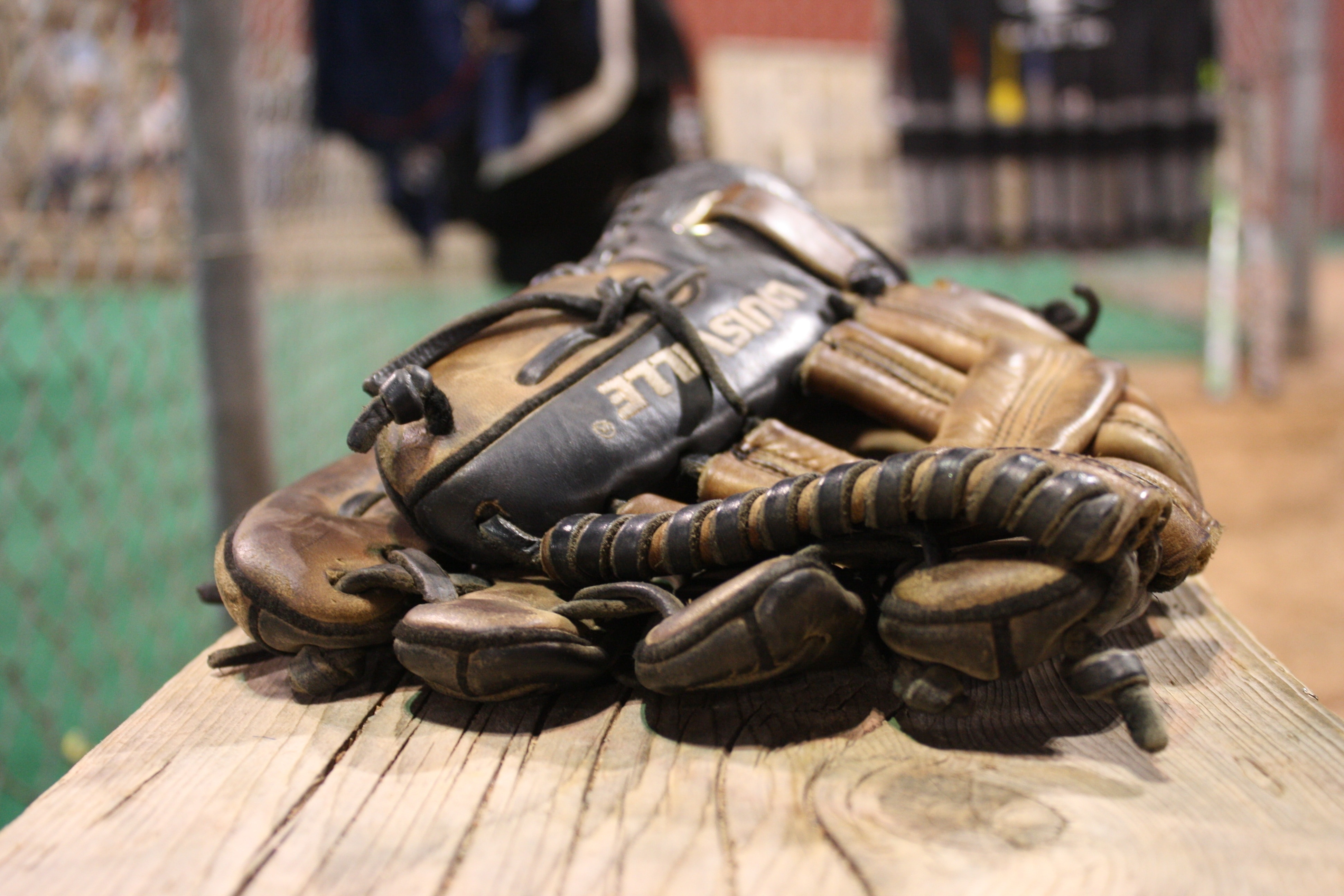 black and brown leather baseball mitt