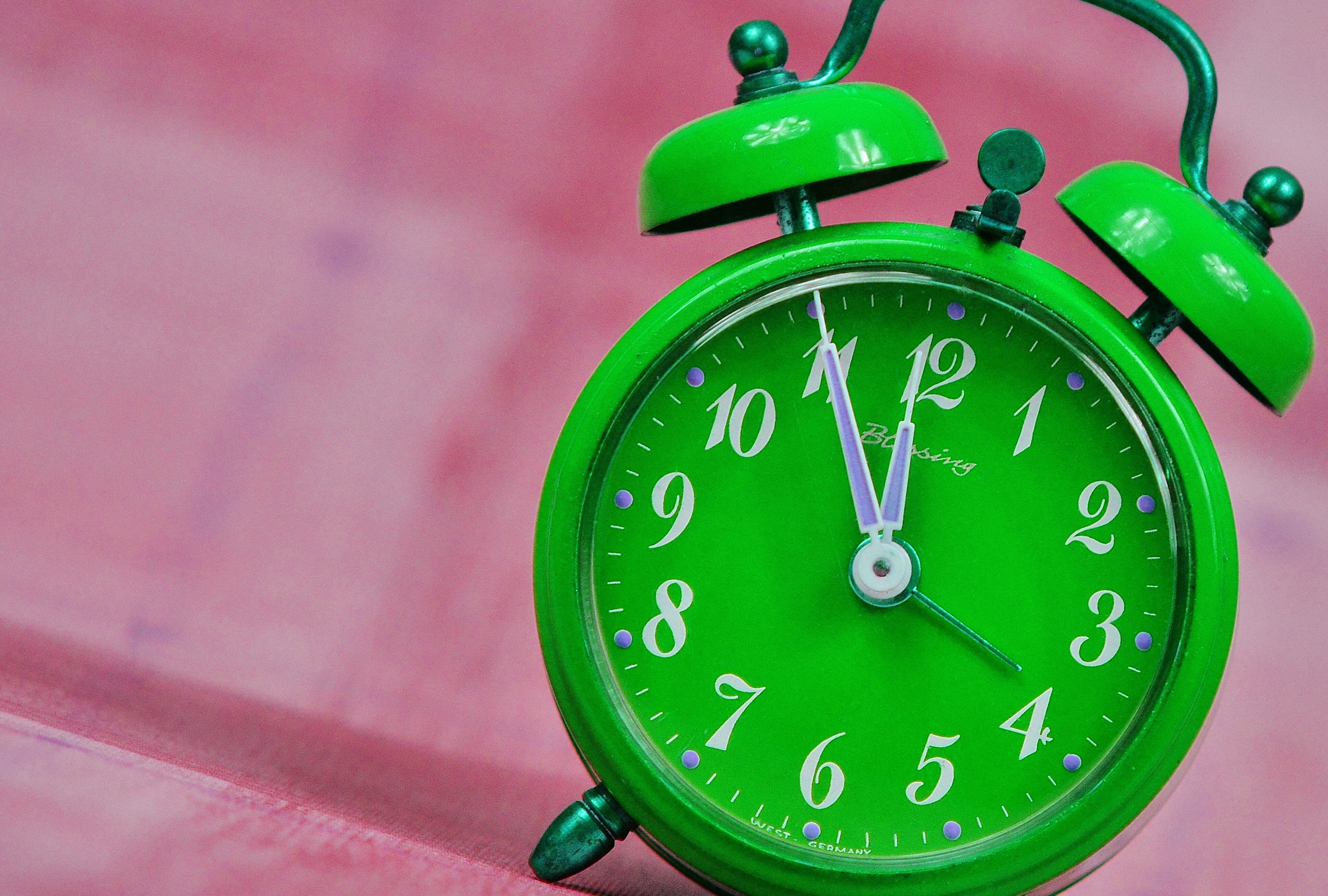 green analog alarm clock