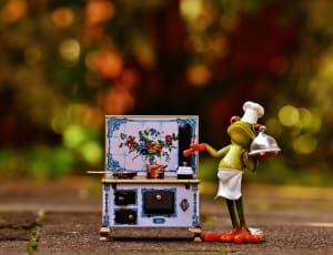 green and red plastic chef frog figurine thumbnail